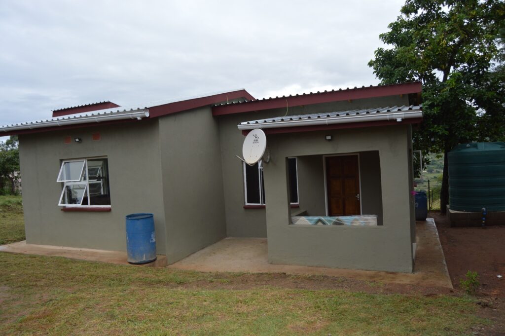 Deputy Prime Minister Thulisile Dladla hands over keys to a new home during her visit to the Hhohho region.