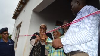 Deputy Prime Minister Thulisile Dladla hands over keys to a new home during her visit to the Hhohho region.