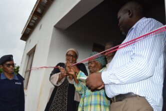 Deputy Prime Minister Thulisile Dladla hands over keys to a new home during her visit to the Hhohho region.