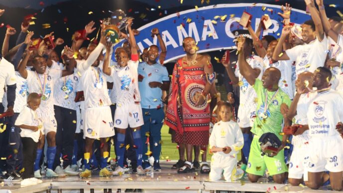 His Majesty King Mswati III presents trophies to the 2025 Ingwenyama Cup champions during a vibrant ceremony at Somhlolo National Stadium.