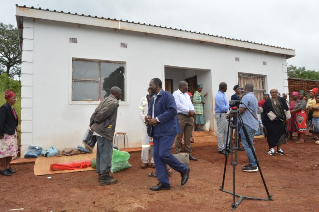 Deputy Prime Minister Thulisile Dladla hands over keys to a new home during her visit to the Hhohho region.