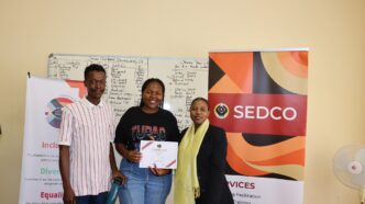 Participants of the ESGM entrepreneurship workshop celebrate the completion of their five-day training at SEDCO Manzini Estate.