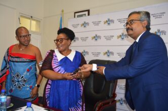 Deputy Prime Minister Thulisile Dladla receives vehicle keys from WFP's Ashraful Amin during the handover ceremony in Mbabane.