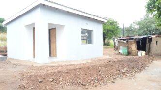Deputy Prime Minister Thulisile Dladla hands over the new house to Mkhulu Albert Magongo in Macetjeni.