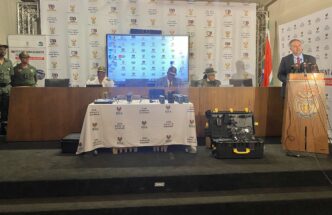 Home Affairs Minister Dr Leon Schreiber inspects a drone ahead of its deployment to strengthen border control over the Easter weekend.