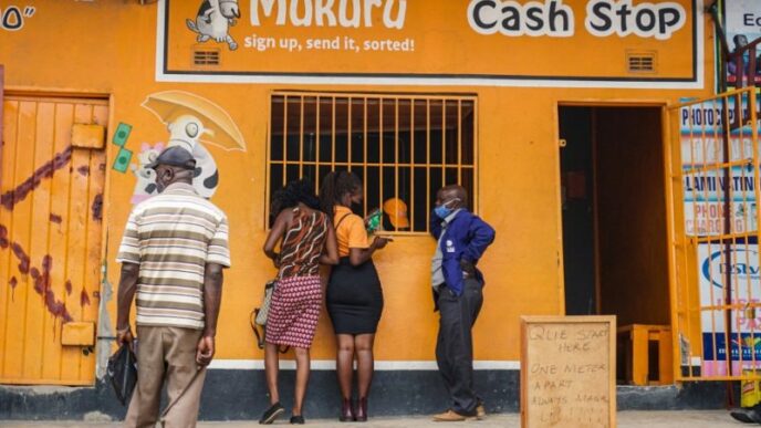 Customers queue at a Mukuru cash collection point