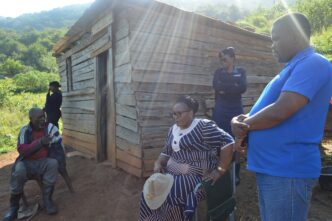 Deputy Prime Minister Thulisile Dladla and Minister Sikhumbuzo Dlamini assess the condition of Mkhulu Magele Shabangu’s collapsing wooden house in Nkwene.