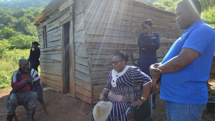Deputy Prime Minister Thulisile Dladla and Minister Sikhumbuzo Dlamini assess the condition of Mkhulu Magele Shabangu’s collapsing wooden house in Nkwene.