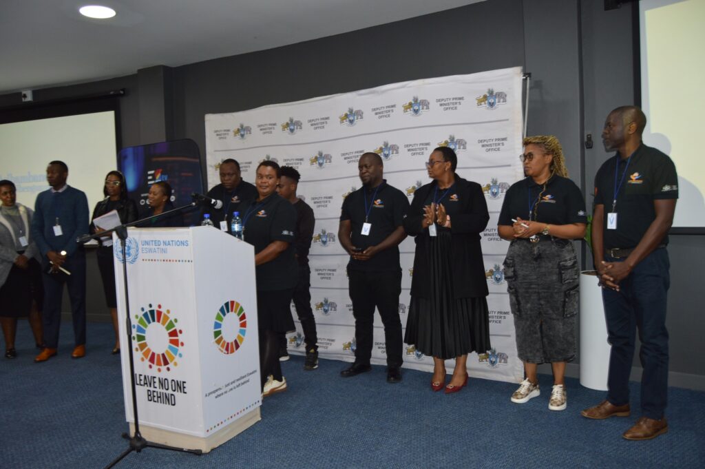 Community leaders and local council representatives who supported the filming of Asibambaneni Sibengumndeni pose with production staff, recognizing grassroots contributions to the family-focused initiative.