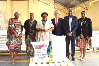 Deputy Prime Minister Thulisile Dladla receives a rice donation from Taiwan’s Ambassador Jeremy Liang during a handover ceremony at the NDMA Warehouse in Matsapha. Photo by DPM Office