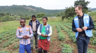 UNDP Resident Representative, Mr Henrik Franklin talks to the Malazas while touring their farm. UNDP/Mantoe Phakathi