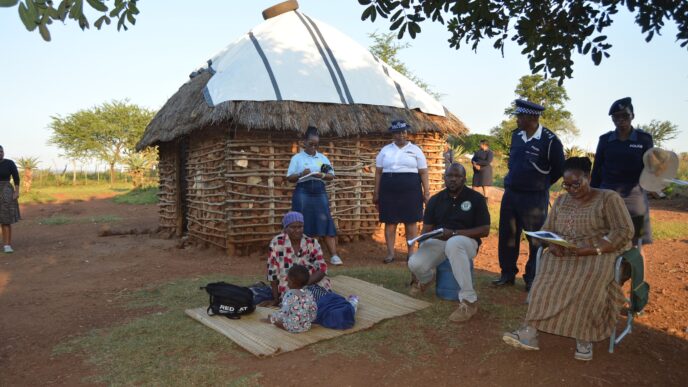 Deputy Prime Minister Thulisile Dladla inspects a dilapidated homestead in Mpolonjeni Inkhundla during a visit to assess housing needs among vulnerable families.