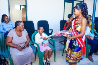 Miss Cultural Heritage Gcinizwi Tsikati celebrates her birthday with children at the Autism Centre in Manzini.