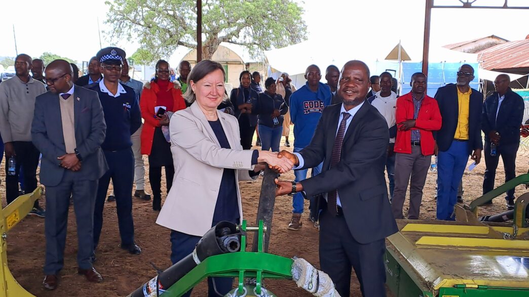 Minister of Agriculture Jabulani Mabuza and the European Union representative share a moment during the official handover of hay-making equipment worth E3.1 million at Mpisi Cattle Breeding Station.