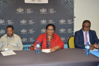 Deputy Prime Minister Thulisile Dladla shares a moment with Members of Parliament during the preview screening of the new family-reunion reality show, Asibambaneni Sibengumndeni, held at her office in Mbabane.