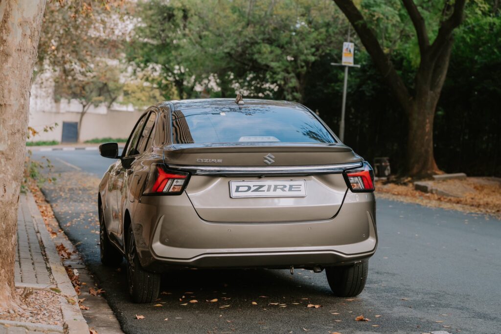 The all-new Suzuki DZire sheds its Swift styling for a bold new look and a larger boot, offering practical sedan comfort in a compact frame.