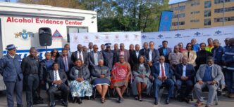Minister Chief Ndlaluhlaza Ndwandwe receives the new Alcohol Evidence Truck from Eswatini Beverages Country Director, Ms. Doreen Tumureebire, at the Ministry of Public Works and Transport in Mbabane. Photo: Ministry of Public Works and Transport building with the Alcohol Evidence Truck parked outside.