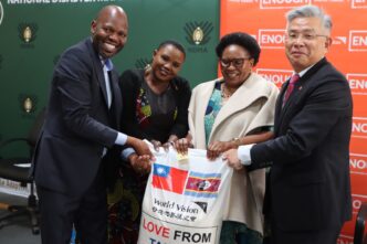 Deputy Prime Minister Thulisile Dladla receives a symbolic bag of rice during the launch of the national food assistance programme at the NDMA Warehouse in Matsapha, following a 2,000-ton donation from the Republic of China (Taiwan). Photo: NDMA