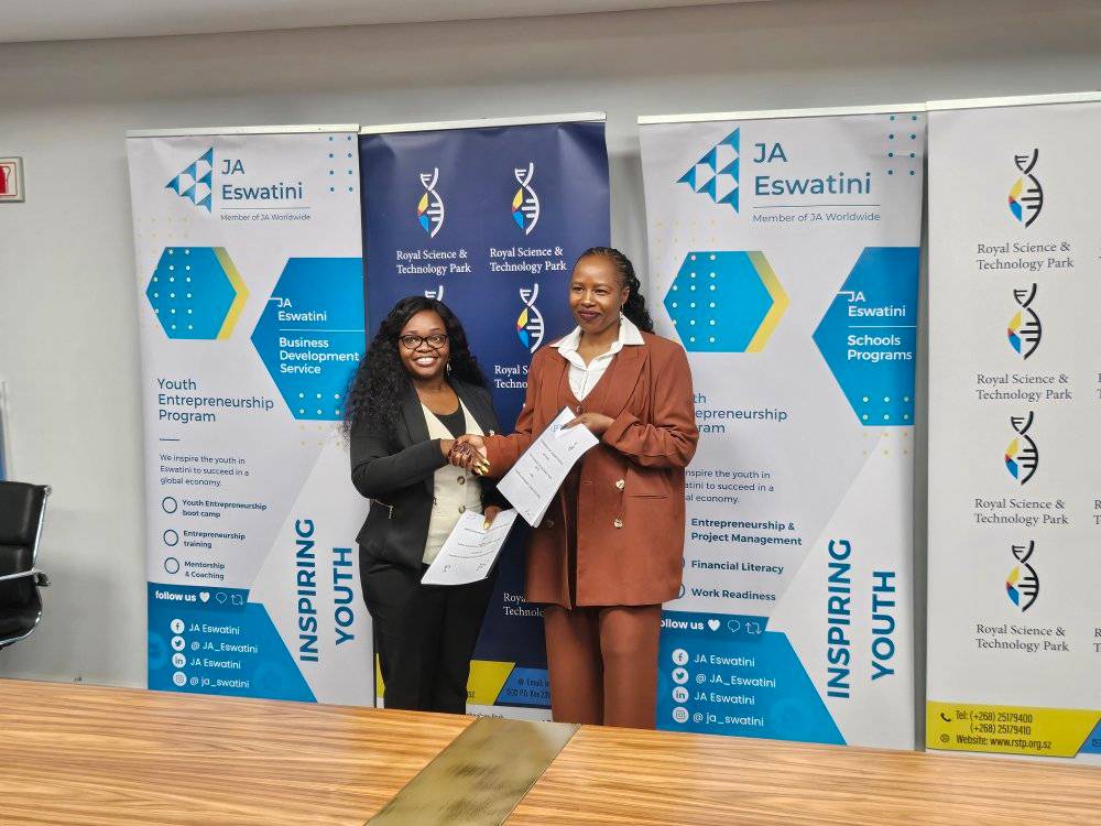 JA Eswatini Executive Director Phetsile Masilela signs the MoU with RSTP Acting CEO Nomvuyo Gulwako during a brief ceremony at the Royal Science and Technology Park. Photo: JA Eswatini