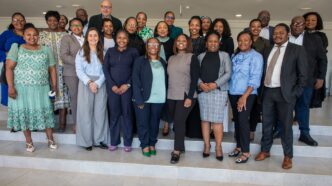 Representatives from the Central Bank of Eswatini, Ministry of Finance, FSRA, and CFI pose for a group photo after a financial inclusion session in Mbabane. Dr. Alfred Hannig, CEO of the Alliance for Financial Inclusion, is seen standing at the back. Photo: Central Bank Eswatini