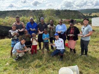 Farmers and officials from the Taiwan Technical Mission pose with a fresh harvest of genetically improved Mozambique tilapia at Shiseweni, celebrating a successful milestone in Eswatini’s aquaculture development.