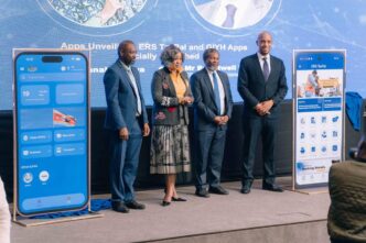 Minister of ICT Savannah Maziya (center) and ERS Commissioner General Brightwell Nkambule (right) unveil the Government In Your Hand and ERS TaxPal mobile applications during the launch event in Ezulwini.