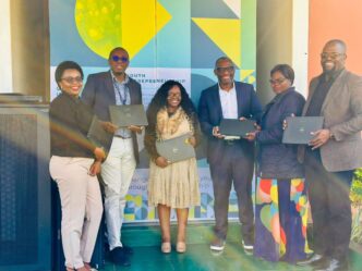 World Bank Resident Representative Ikechi Okorie hands over laptops to JA Eswatini Executive Director Phetsile Masilela during a courtesy visit at the organisation's offices in Mbabane.