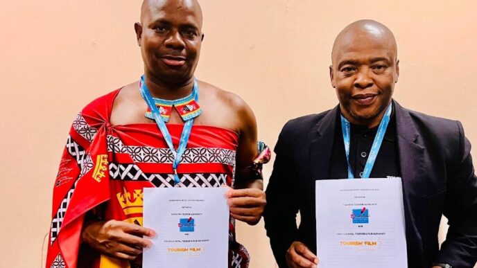 ETA CEO Vusie N. Dlamini and Acting KZN Tourism & Film CEO Dr. Sibusiso Gumbi shake hands after signing a tourism partnership agreement at Africa’s Travel Indaba in Durban.