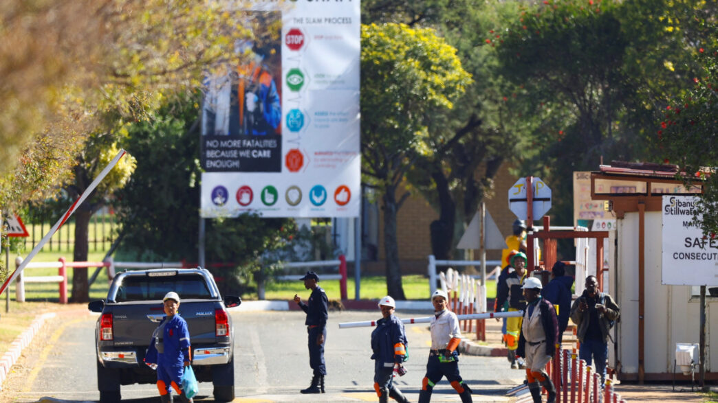 Mine workers walk after being rescued from underground at the Sibanye Stillwater mine in Westonaria, near Johannesburg, South Africa, May 23, 2025. They were trapped underground at one of the shafts at the Kloof gold mine. REUTERS/Siphiwe Sibeko