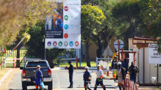 Mine workers walk after being rescued from underground at the Sibanye Stillwater mine in Westonaria, near Johannesburg, South Africa, May 23, 2025. They were trapped underground at one of the shafts at the Kloof gold mine. REUTERS/Siphiwe Sibeko