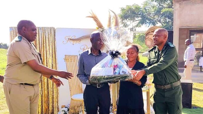 Retiring officers honored: Big Bend Correctional staff present gifts to Assistant Chief Officer Ernest Dlamini and Sergeants Jeremiah Maziya and Mbuyazwe Gina during a farewell event held at the facility.