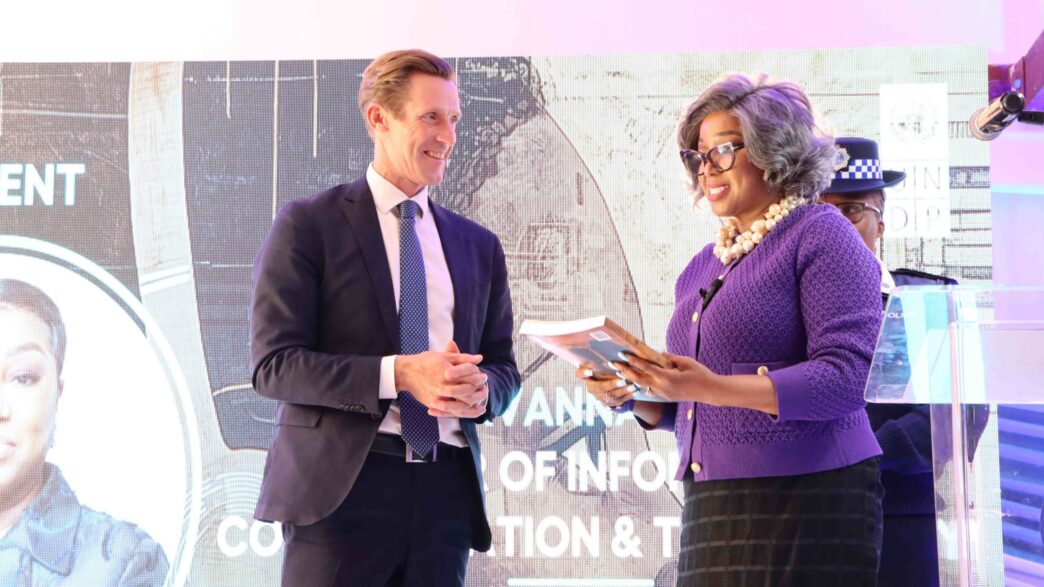 UNDP Resident Representative, Mr. Henrik Franklin, hands over the 2025 Human Development Report to the Minister of ICT, Hon. Savannah Maziya. UNDP/Thoba Dlamini