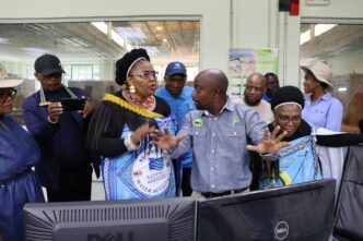 South Africa’s Minister of Water and Sanitation, Pemmy Majodina, engaging with officials during her tour of the Maguga Hydro Power Station.