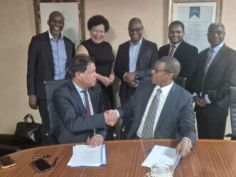 EIPA CEO Mr Sibani Mngomezulu and IZP CEO Mr Lionel October shake hands after signing the Memorandum of Understanding to strengthen Eswatini’s Special Economic Zones framework.