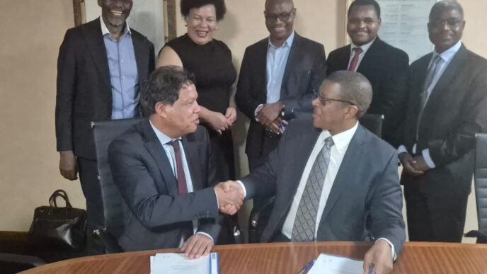EIPA CEO Mr Sibani Mngomezulu and IZP CEO Mr Lionel October shake hands after signing the Memorandum of Understanding to strengthen Eswatini’s Special Economic Zones framework.