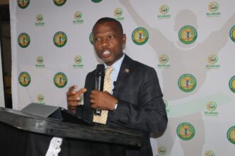 The Honourable Minister of Housing and Urban Development, Appolo Maphalala, addresses guests at the launch of the Nhlangano Town Council Marathon 2026 at Shingili Plaas Restaurant.