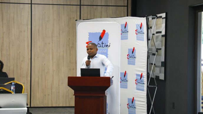 Gcina Dlamini presenting the 2026 Domestic Tourism Study findings during the stakeholder session at Happy Valley. Photo by ESEPARC.