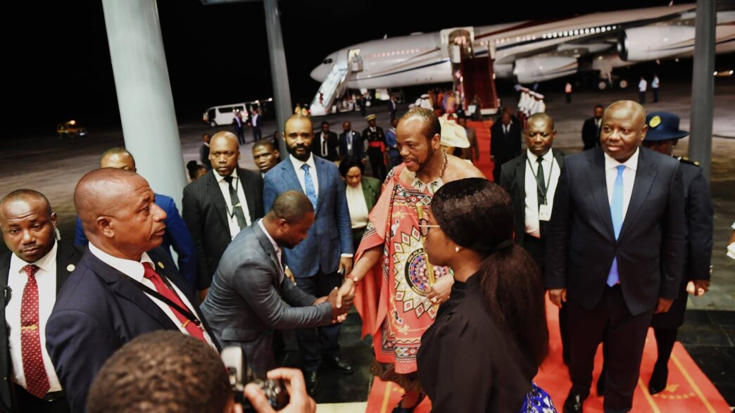 His Majesty King Mswati III greets a government official upon arrival at the 11th OACPS Summit in Malabo, Equatorial Guinea.