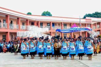 The school choir blending their choral tunes with culture & traditional dance. photo by HMCS