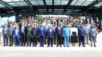 Casimiro Mueio and Indian High Commissioner Robert Shetkintong pose for a group photo with defence officials and industry representatives from Mozambique and India during the Defence Industry Seminar in Maputo.