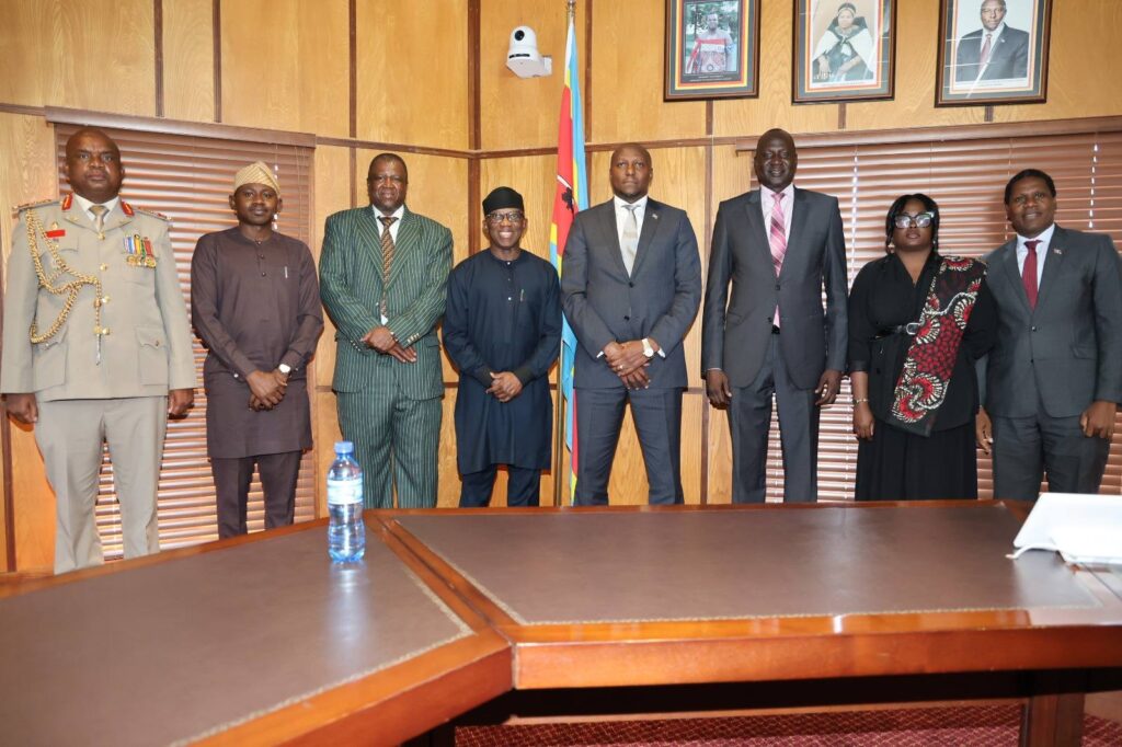Prime Minister Russell Mmiso Dlamini poses for a group photo with African Union Commissioner Ambassador Bankole Adeoye and government officials following the presentation of the Effective Governance Peace Division award in Mbabane.