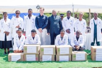 Minister of Economic Planning and Development Honourable Dr Thambo E Gina and UNDP Resident Representative Mr Henrik Franklin pose with some of the young entrepreneurs who received cellphone repair starter kits at Lubuli Inkhundla. Photo by UNDP Eswatini.