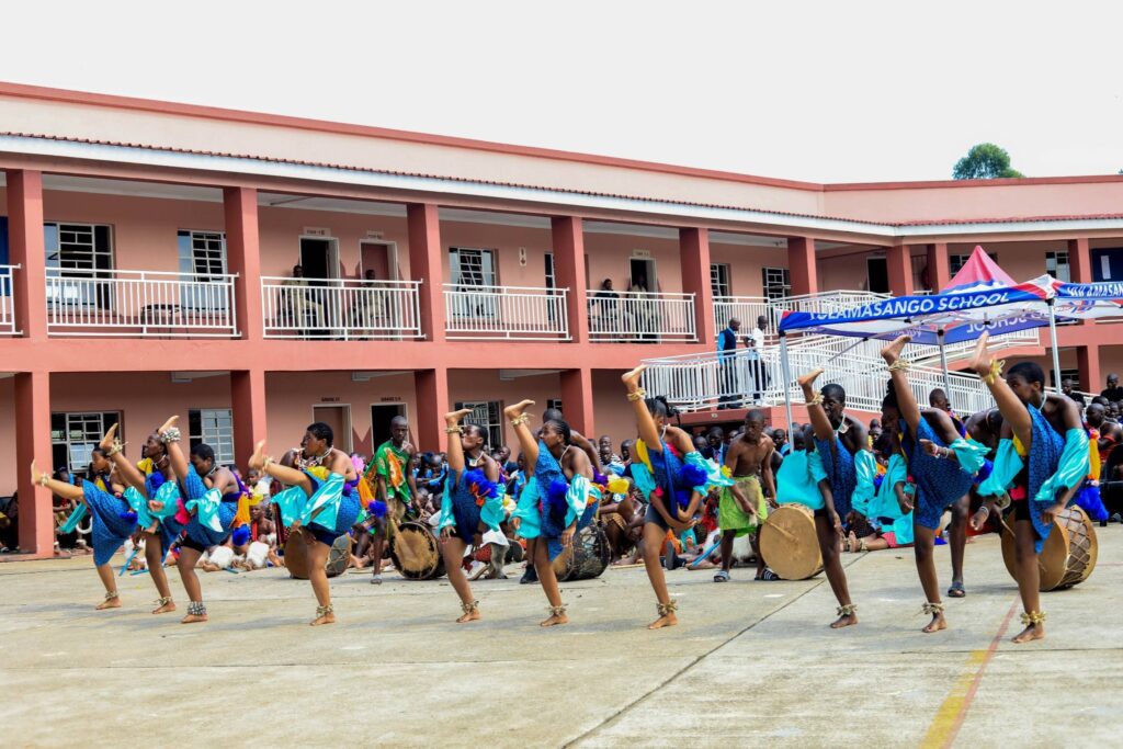 The school choir blending their choral tunes with culture & traditional dance. photo by HMCS