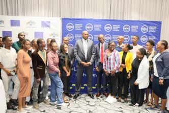 Prime Minister Russell Mmiso Dlamini and Minister of Sports, Culture & Youth Affairs Bongani Nzima pose with young people after the launch of the National Youth Development Coordination Framework in Mbabane.