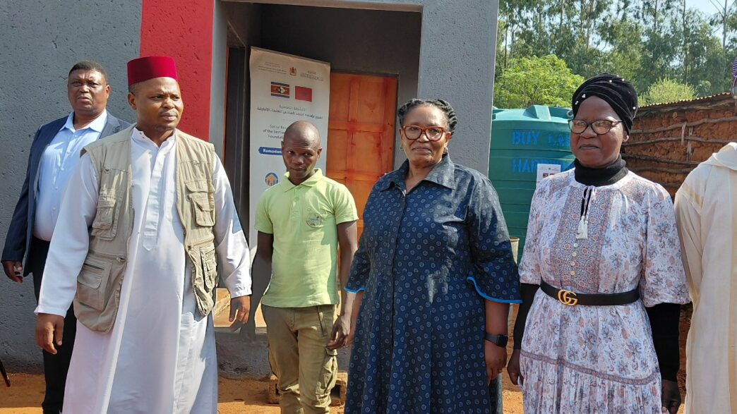 Tiyeni KaLamgabhi Deputy Prime Minister Thulisile Dladla and Mohammed Foundation Chairman Sayed Dlamini stand in front of the newly built house handed over to Mfanufikile Dlamini under Hhukwini Inkhundla.