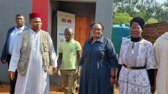 Tiyeni KaLamgabhi Deputy Prime Minister Thulisile Dladla and Mohammed Foundation Chairman Sayed Dlamini stand in front of the newly built house handed over to Mfanufikile Dlamini under Hhukwini Inkhundla.