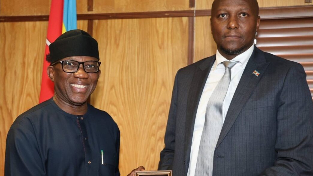 Prime Minister Russell Mmiso Dlamini receives the Effective Governance Peace Division award from African Union Commissioner Ambassador Bankole Adeoye at the Private and Cabinet Office in Mbabane.