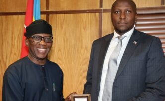 Prime Minister Russell Mmiso Dlamini receives the Effective Governance Peace Division award from African Union Commissioner Ambassador Bankole Adeoye at the Private and Cabinet Office in Mbabane.