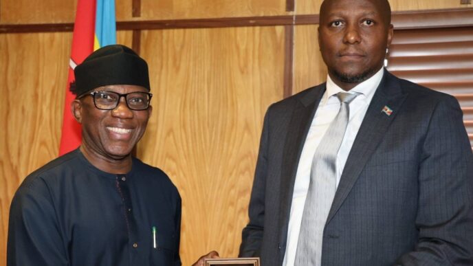 Prime Minister Russell Mmiso Dlamini receives the Effective Governance Peace Division award from African Union Commissioner Ambassador Bankole Adeoye at the Private and Cabinet Office in Mbabane.