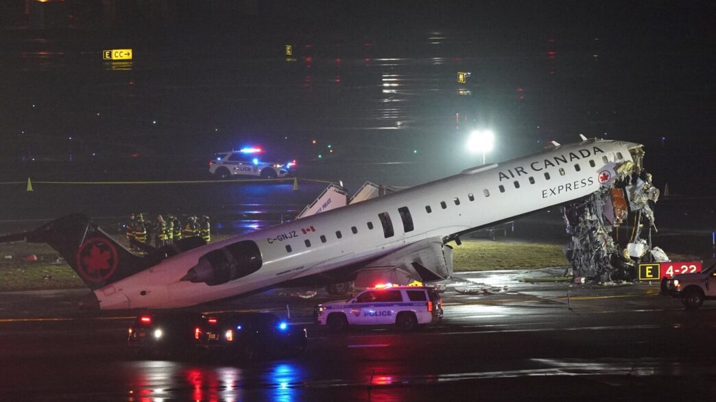 Emergency crews work around an Air Canada Express jet that had collided with a ground vehicle at New York's La Guardia Airport in Queens, New York, U.S. March 23, 2026. REUTERS/Bing Guan